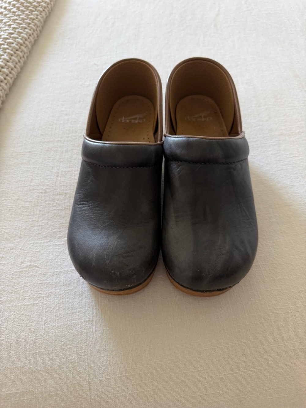 Dansko Black Leather Clogs with Brown Trim
